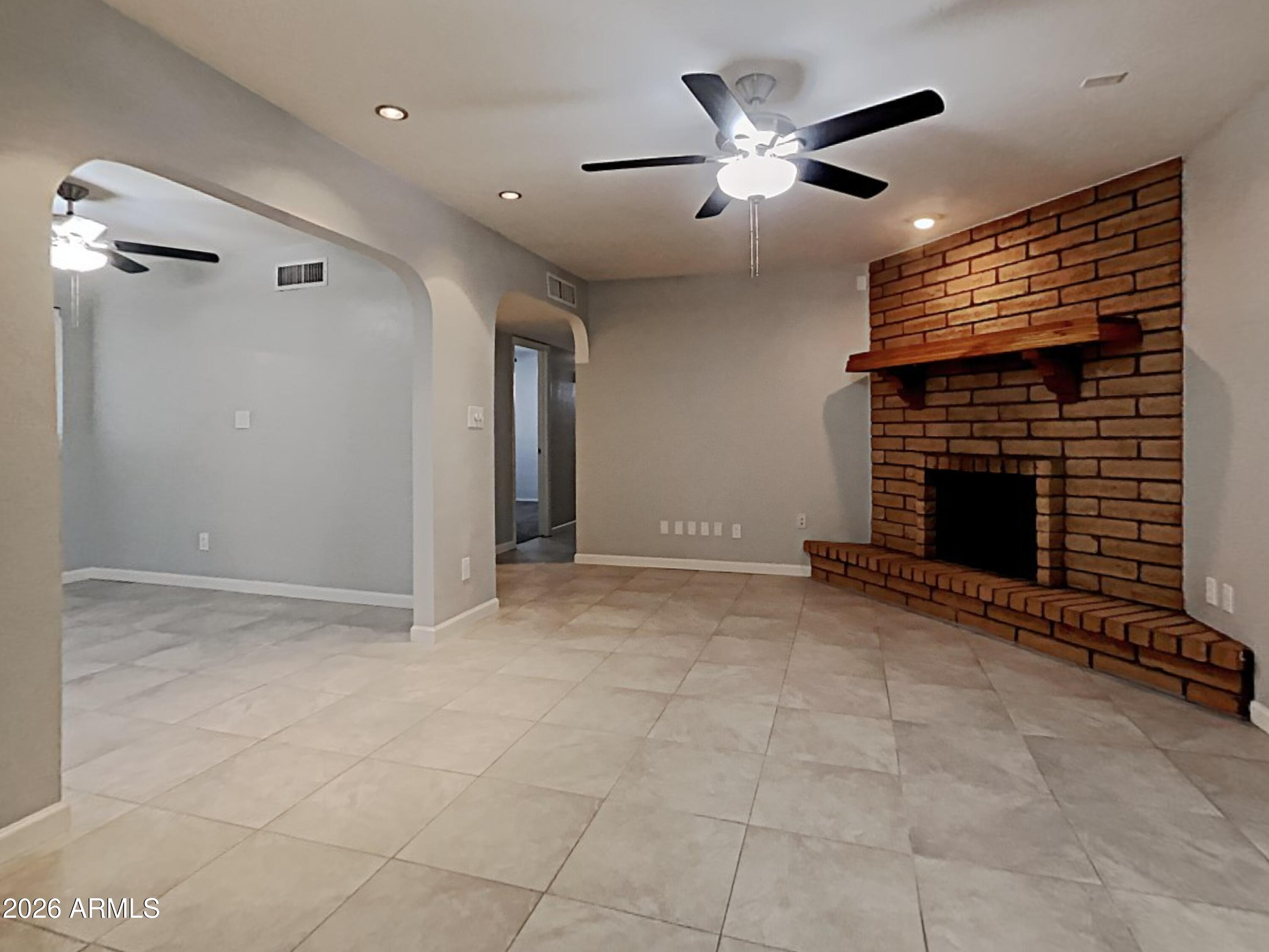 1001 West Villa Rita Drive Phoenix, AZ 85023 - Photo 5 of 26 a view of an empty room with a fireplace
