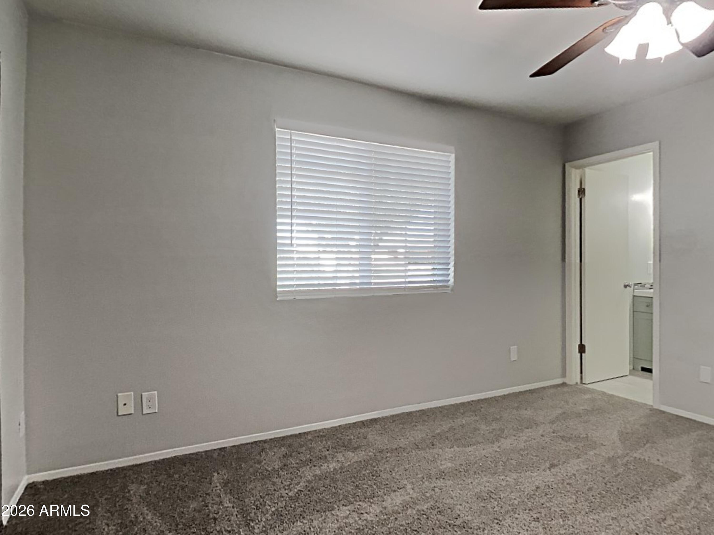 1001 West Villa Rita Drive Phoenix, AZ 85023 - Photo 10 of 26 a view of an empty room with a window