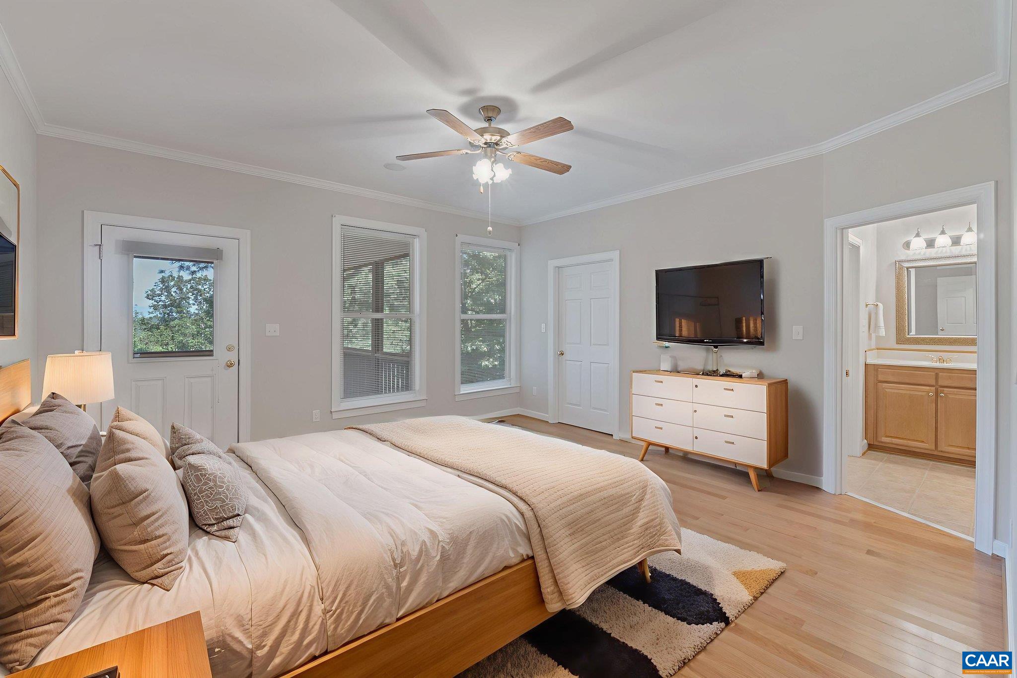 680 Explorers Road Charlottesville, VA 22911 - Photo 17 of 46 a bedroom with a bed and a flat screen tv