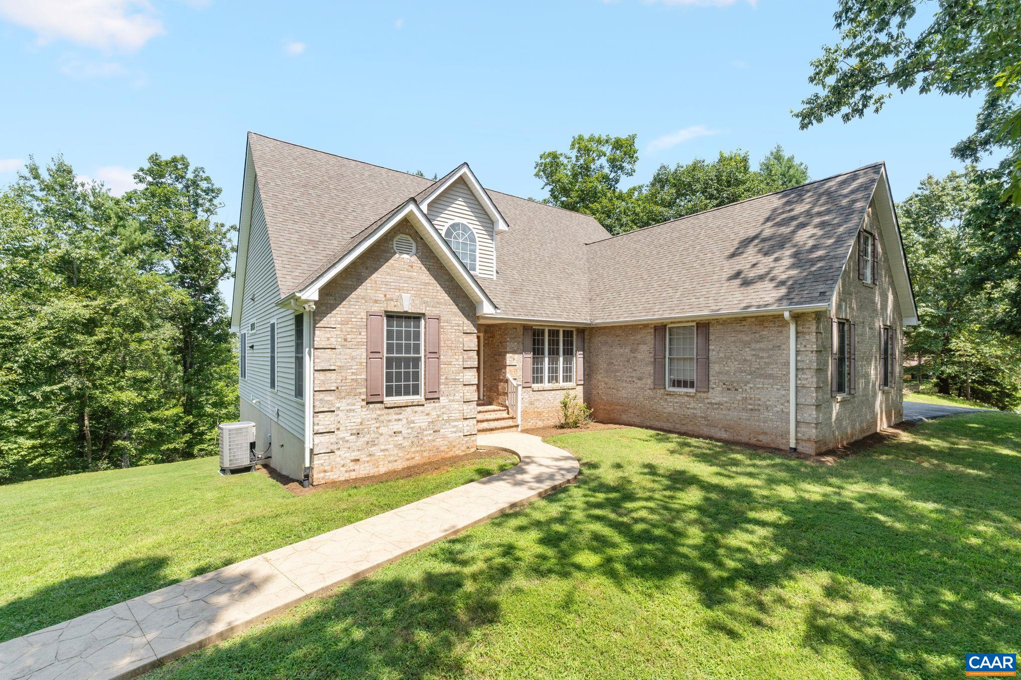 680 Explorers Road Charlottesville, VA 22911 - Photo 2 of 46 a view of a house with a yard and garden