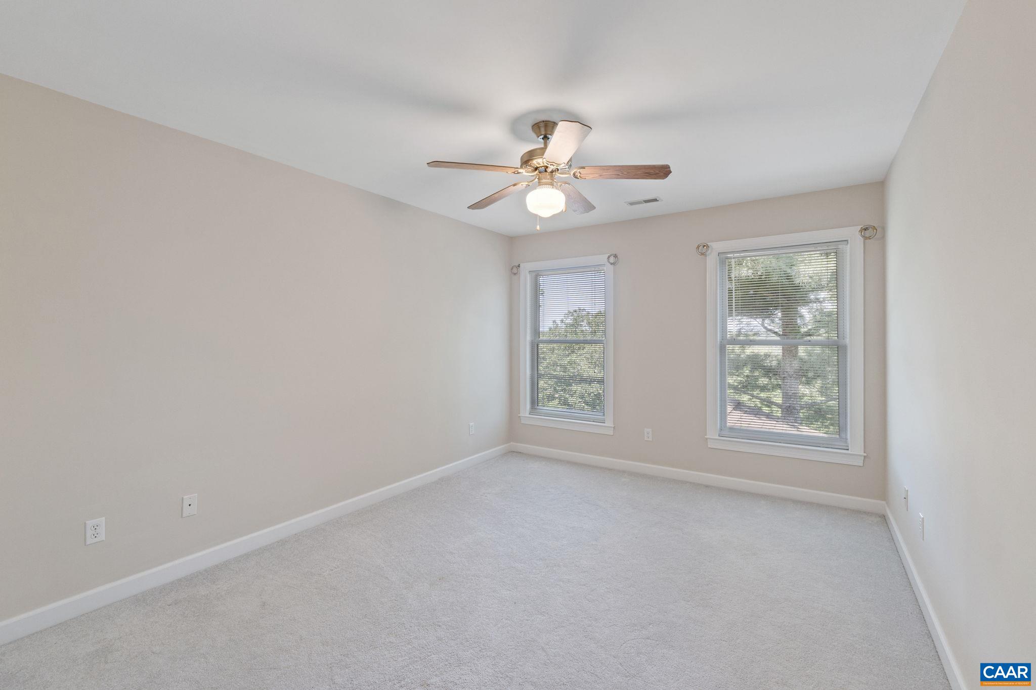 680 Explorers Road Charlottesville, VA 22911 - Photo 24 of 46 an empty room with windows and fan