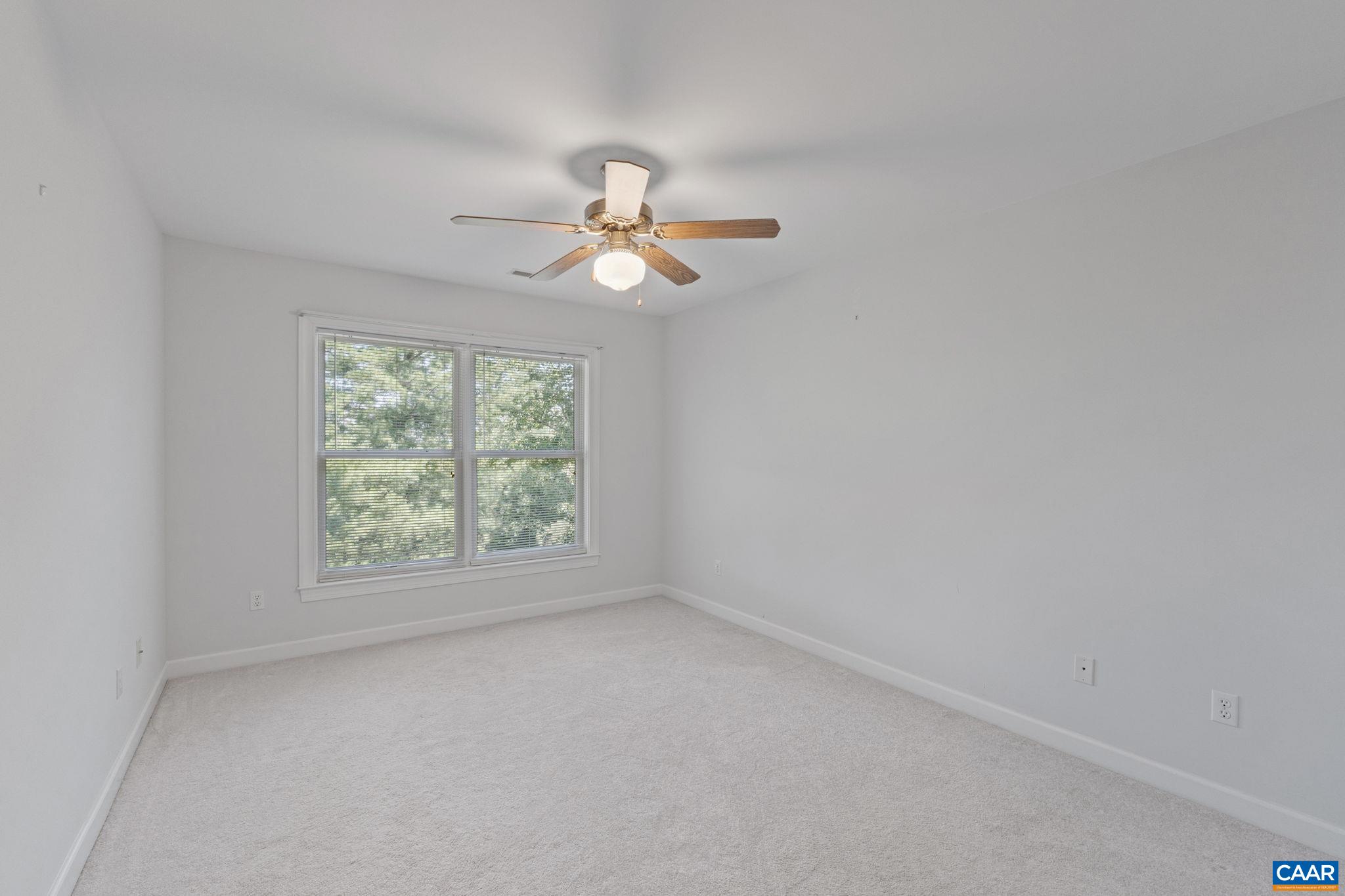 680 Explorers Road Charlottesville, VA 22911 - Photo 25 of 46 an empty room with a window and a fan