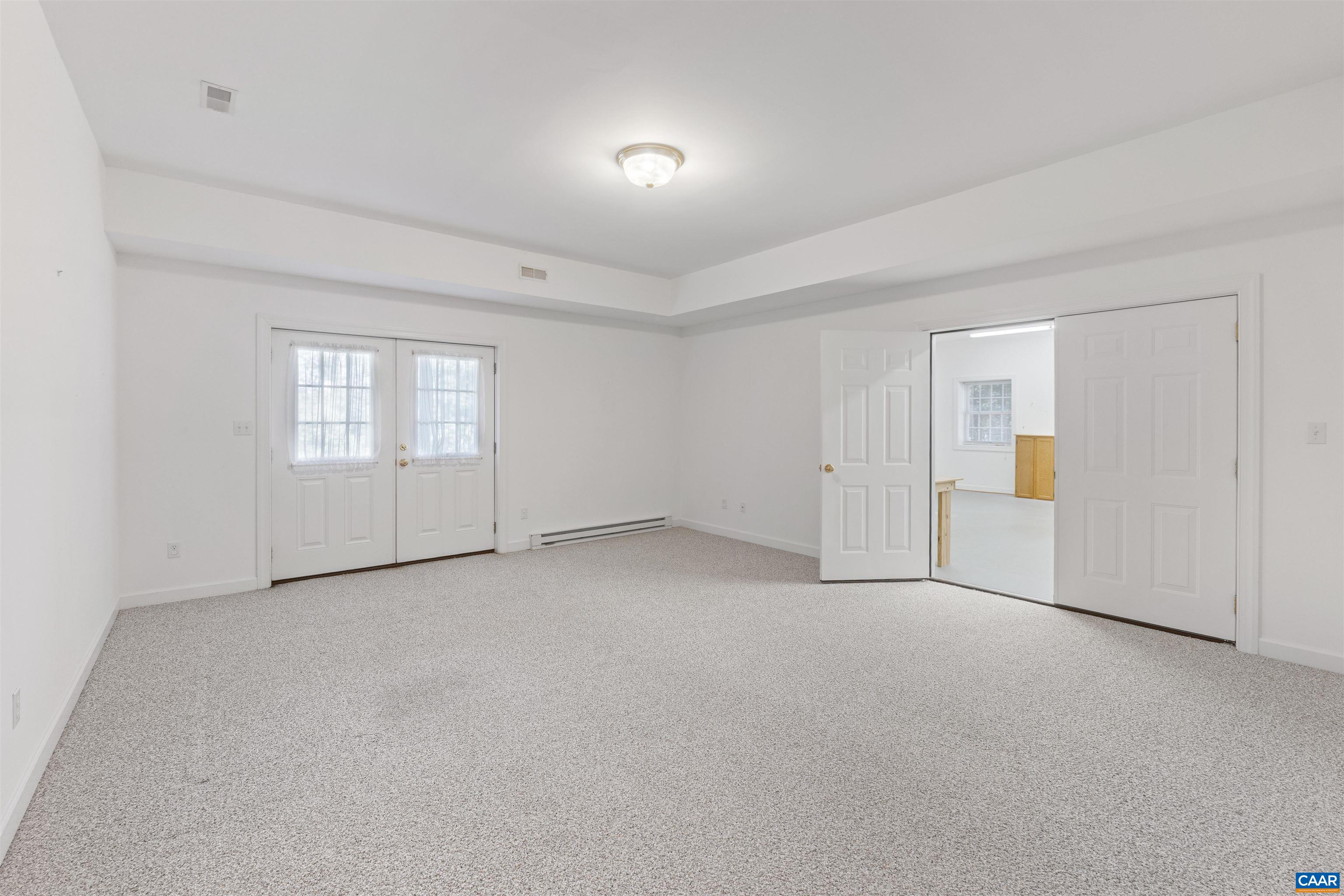 680 Explorers Road Charlottesville, VA 22911 - Photo 29 of 46 an empty room with windows