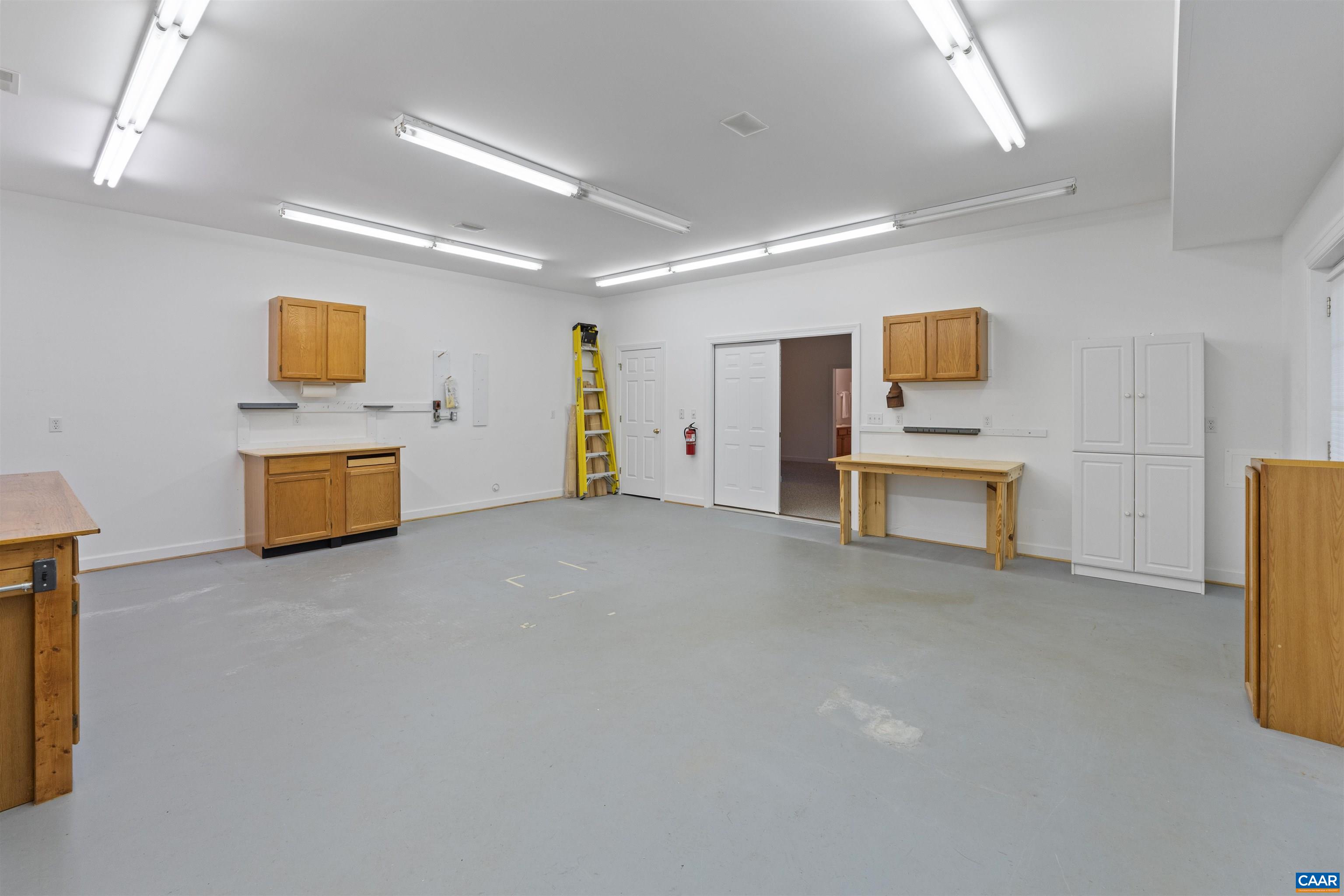 680 Explorers Road Charlottesville, VA 22911 - Photo 37 of 46 a room with furniture and a flat screen tv