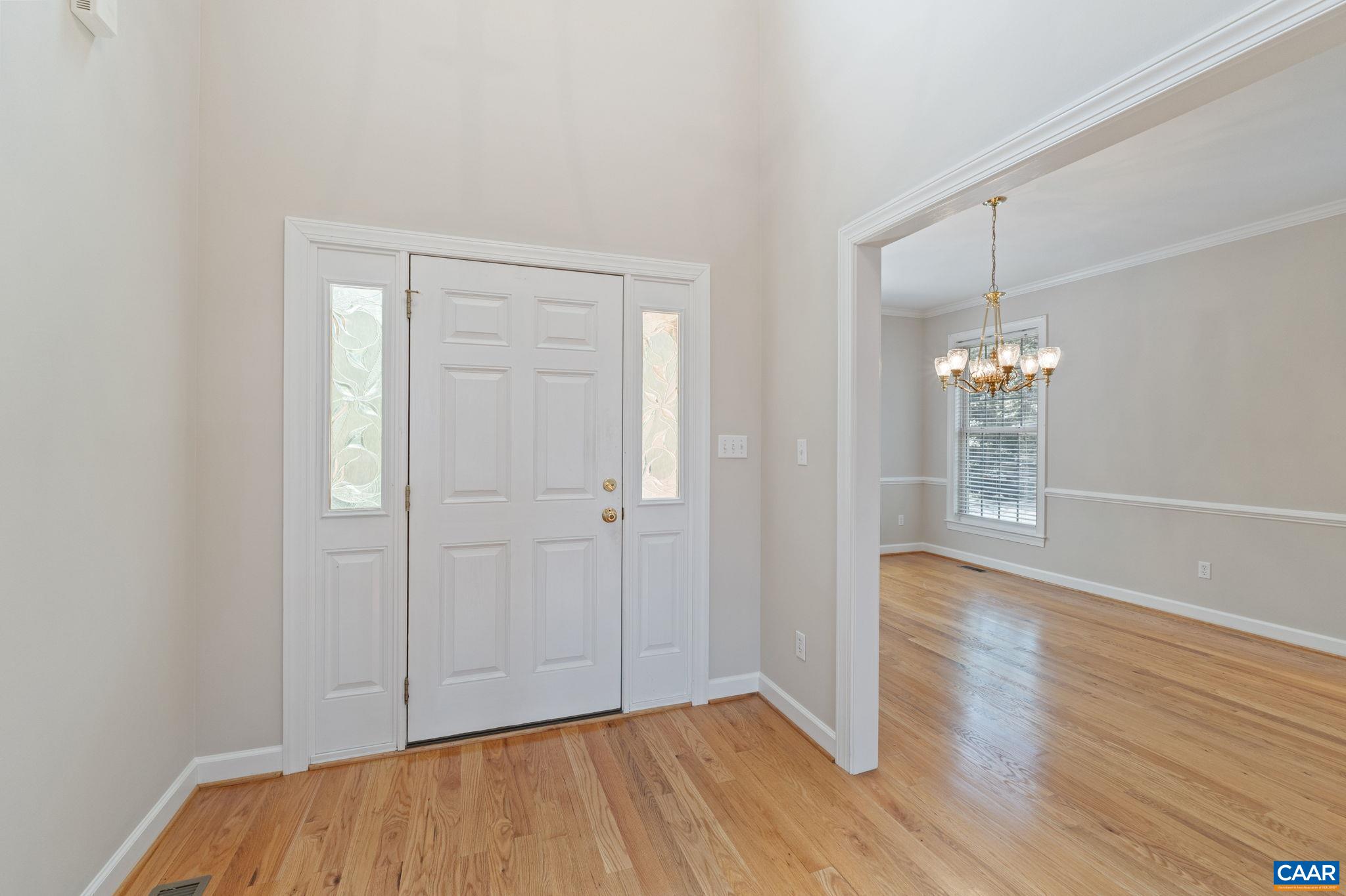680 Explorers Road Charlottesville, VA 22911 - Photo 4 of 46 an empty room with wooden floor and windows