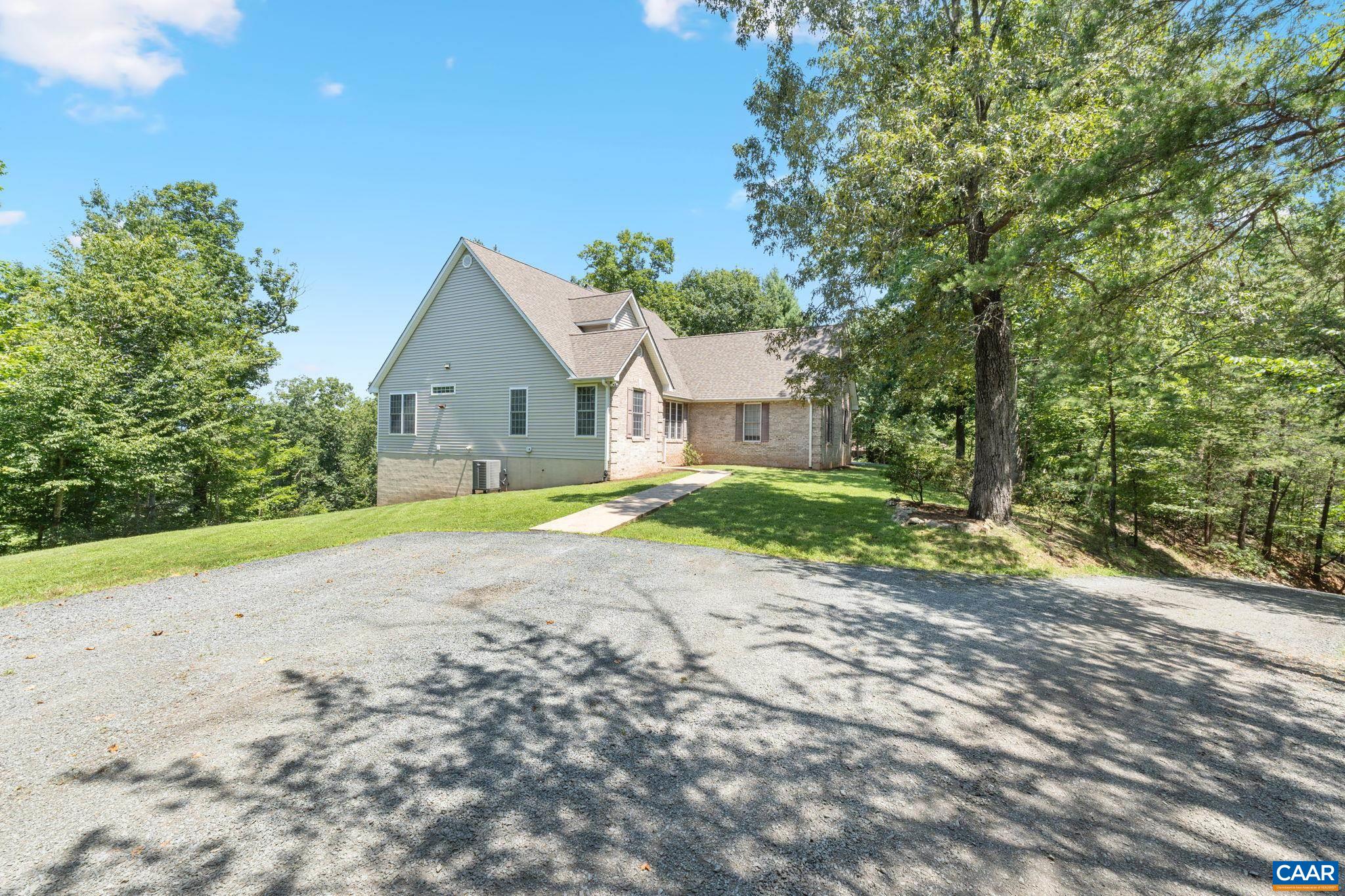 680 Explorers Road Charlottesville, VA 22911 - Photo 43 of 46 a view of a house with a yard and large trees