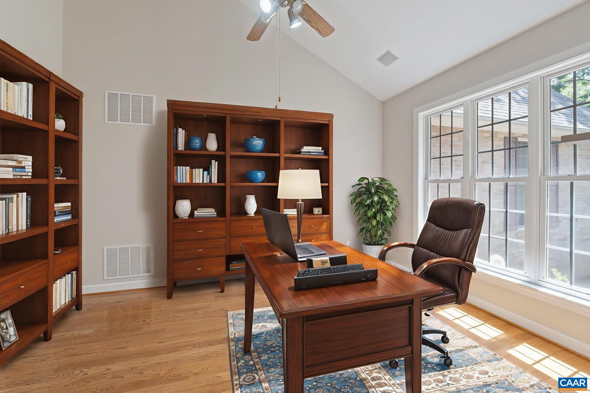 680 Explorers Road Charlottesville, VA 22911 - Photo 5 of 46 a view of a workspace with furniture and a potted plant