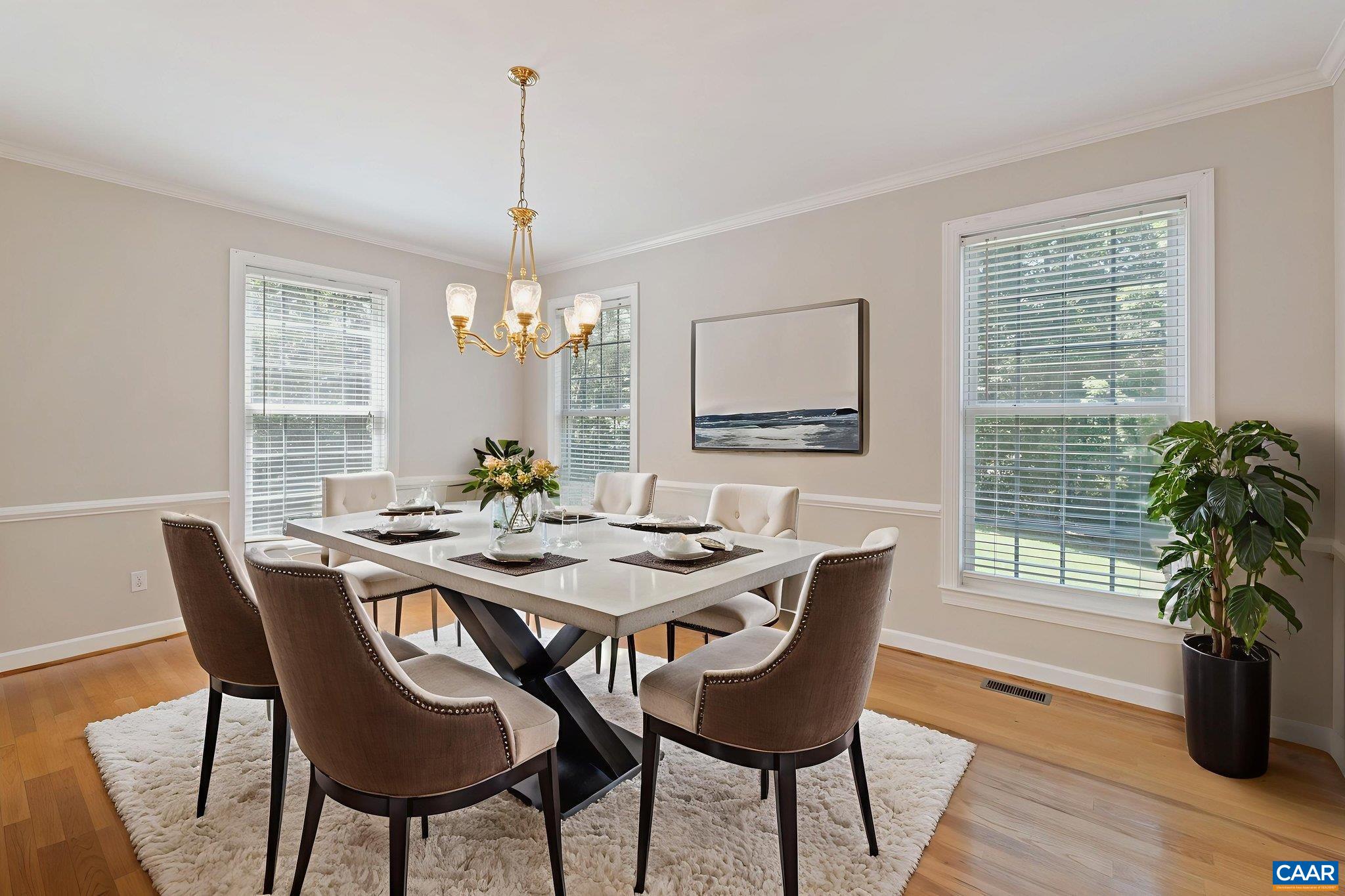 680 Explorers Road Charlottesville, VA 22911 - Photo 6 of 46 a dining room with furniture potted plants and wooden floor