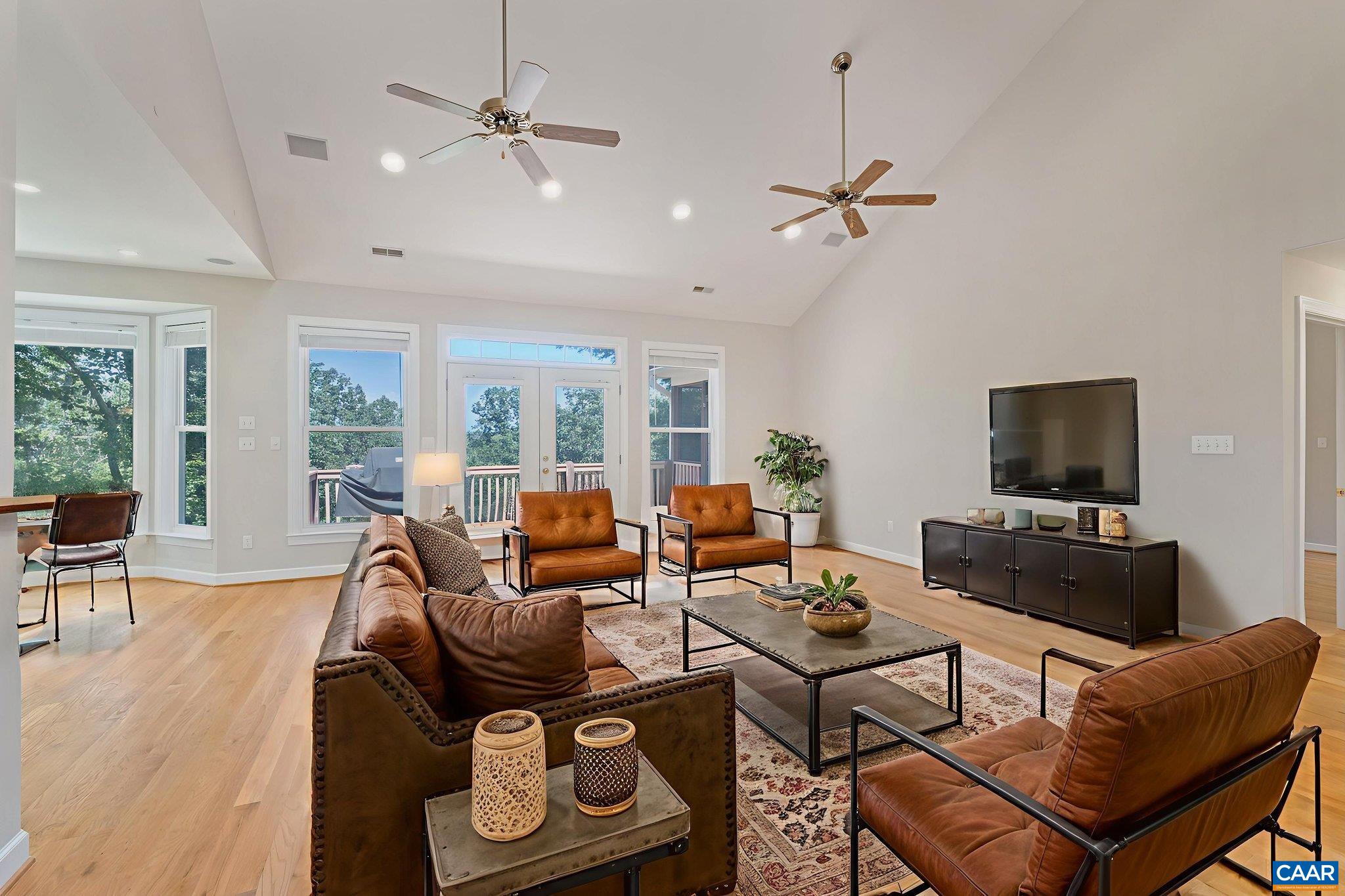 680 Explorers Road Charlottesville, VA 22911 - Photo 7 of 46 a living room with furniture a flat screen tv and a window