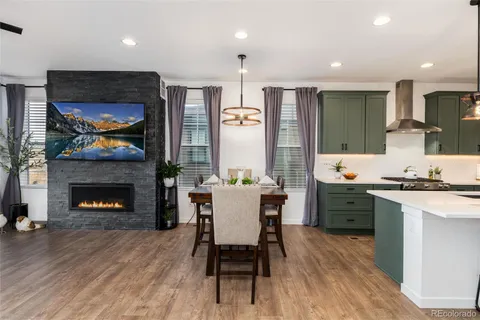 a kitchen with a table and chairs in it