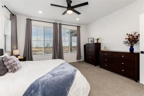 a bedroom with bed and window