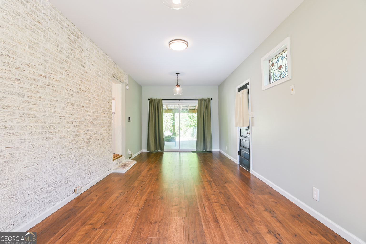 545 Forest Hill Road Macon, GA 31210 - Photo 37 of 63 a view of an empty room with wooden floor and a window