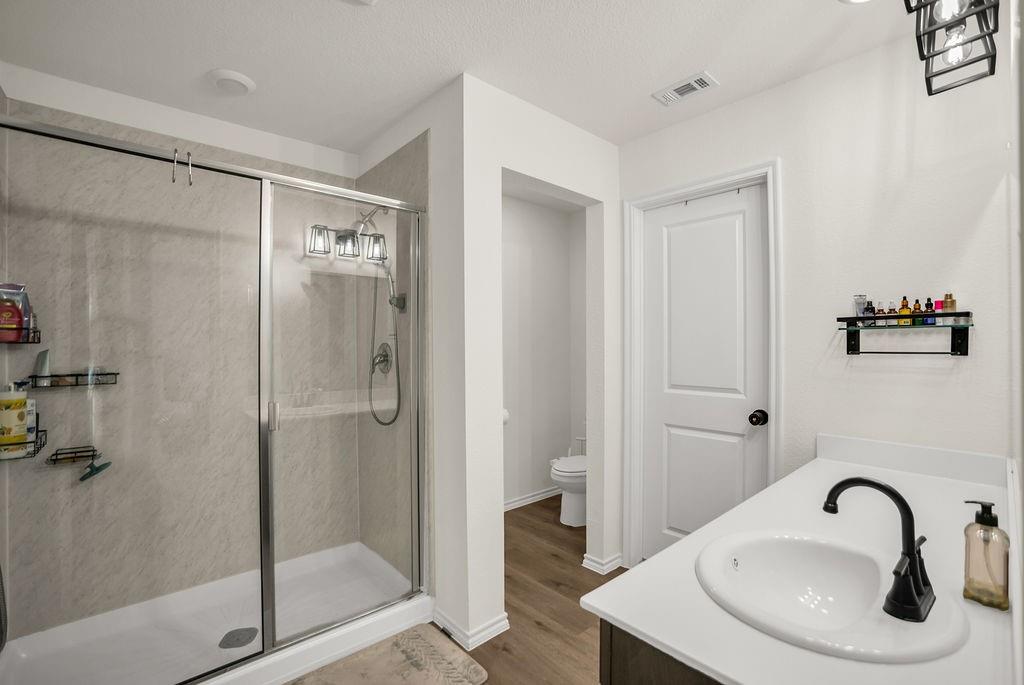 608 Daybreak Lane Lavon, TX 75166 - Photo 22 of 36 a bathroom with a sink and mirror