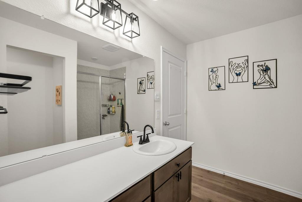 608 Daybreak Lane Lavon, TX 75166 - Photo 23 of 36 a bathroom with a sink and a mirror