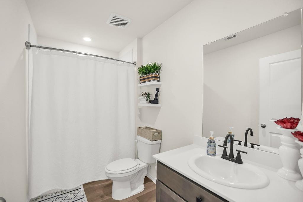 608 Daybreak Lane Lavon, TX 75166 - Photo 25 of 36 a bathroom with a sink toilet and shower