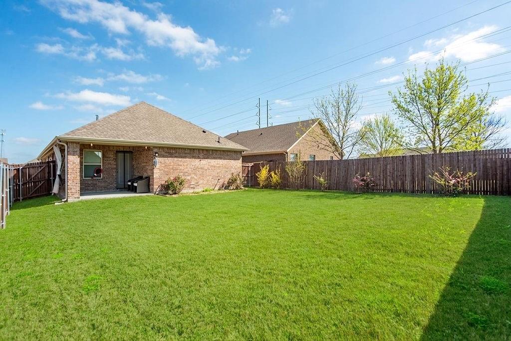 608 Daybreak Lane Lavon, TX 75166 - Photo 29 of 36 a front view of a house with garden