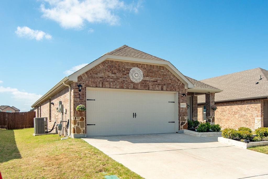 608 Daybreak Lane Lavon, TX 75166 - Photo 3 of 36 a front view of a house with a yard