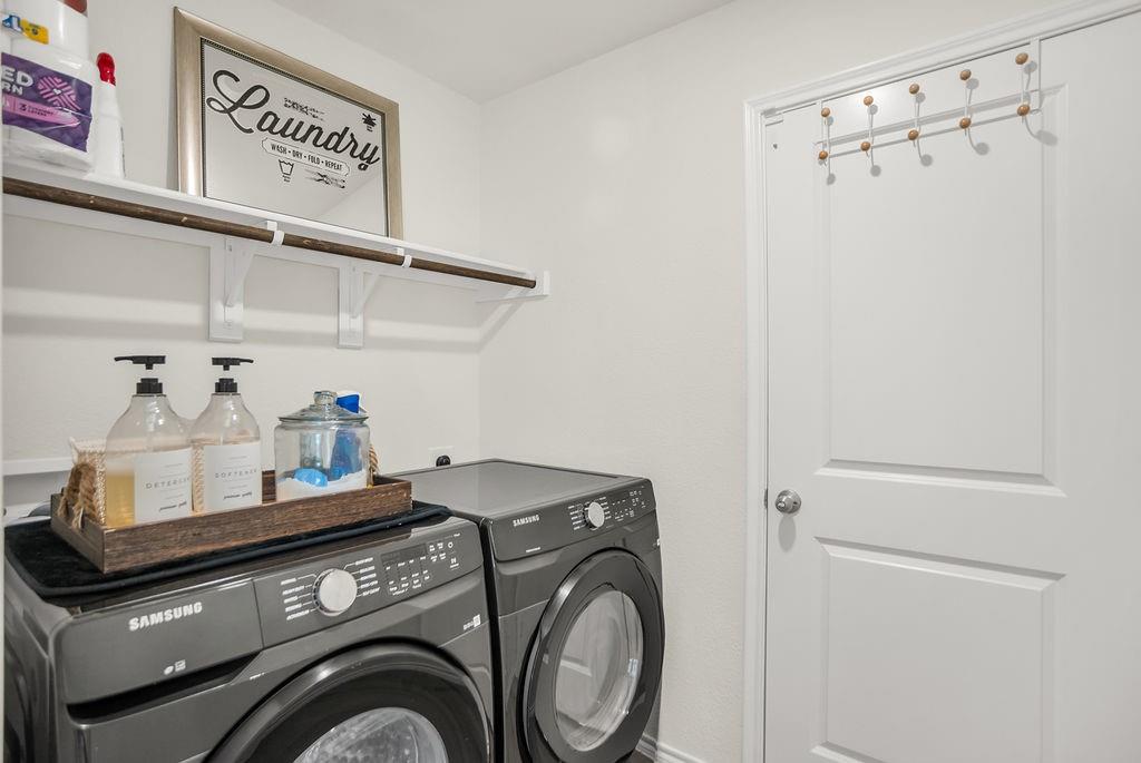 608 Daybreak Lane Lavon, TX 75166 - Photo 10 of 36 a utility room with dryer and washer