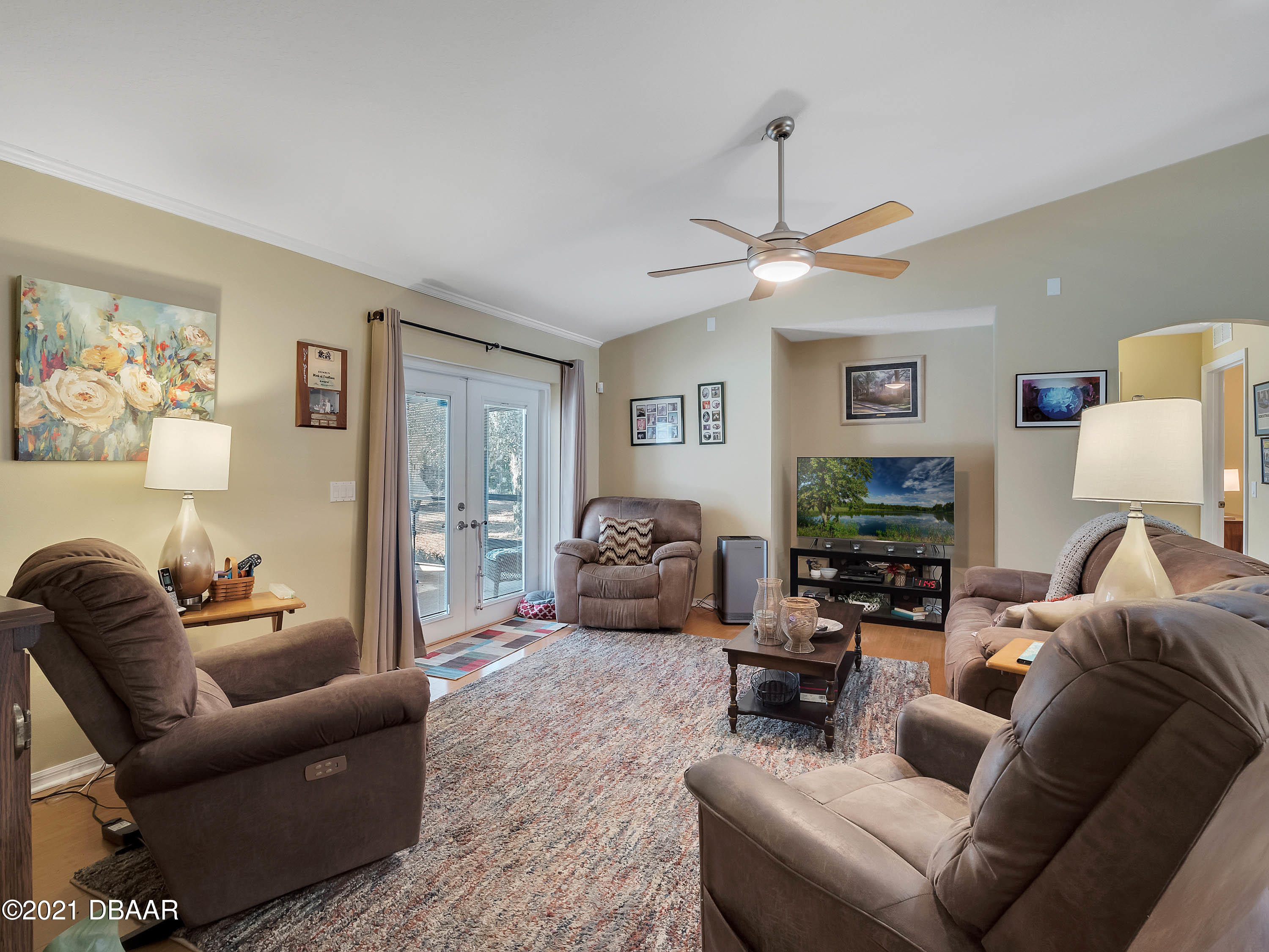 2800 Larkspur Road DeLand, FL 32724 - Photo 11 of 33 a living room with furniture a couch and a flat screen tv