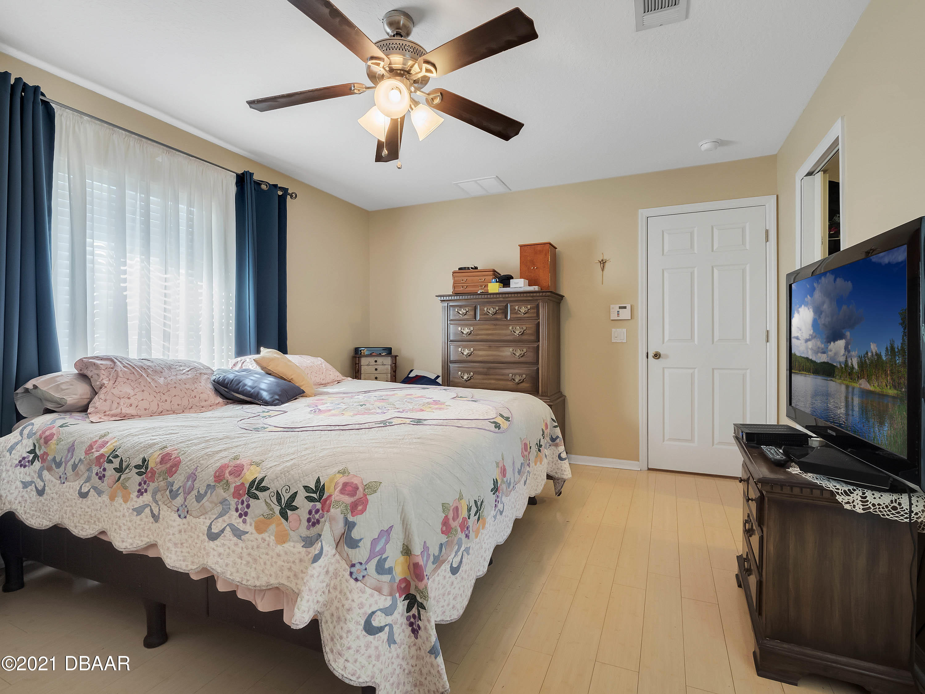 2800 Larkspur Road DeLand, FL 32724 - Photo 14 of 33 a bedroom with a bed and a flat screen tv