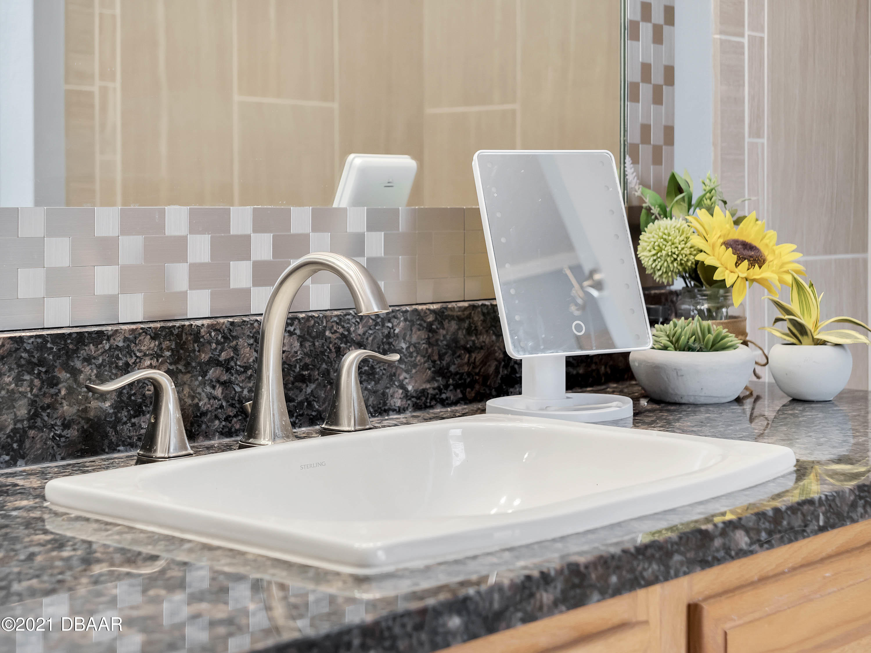 2800 Larkspur Road DeLand, FL 32724 - Photo 17 of 33 a close view of sink and mirror