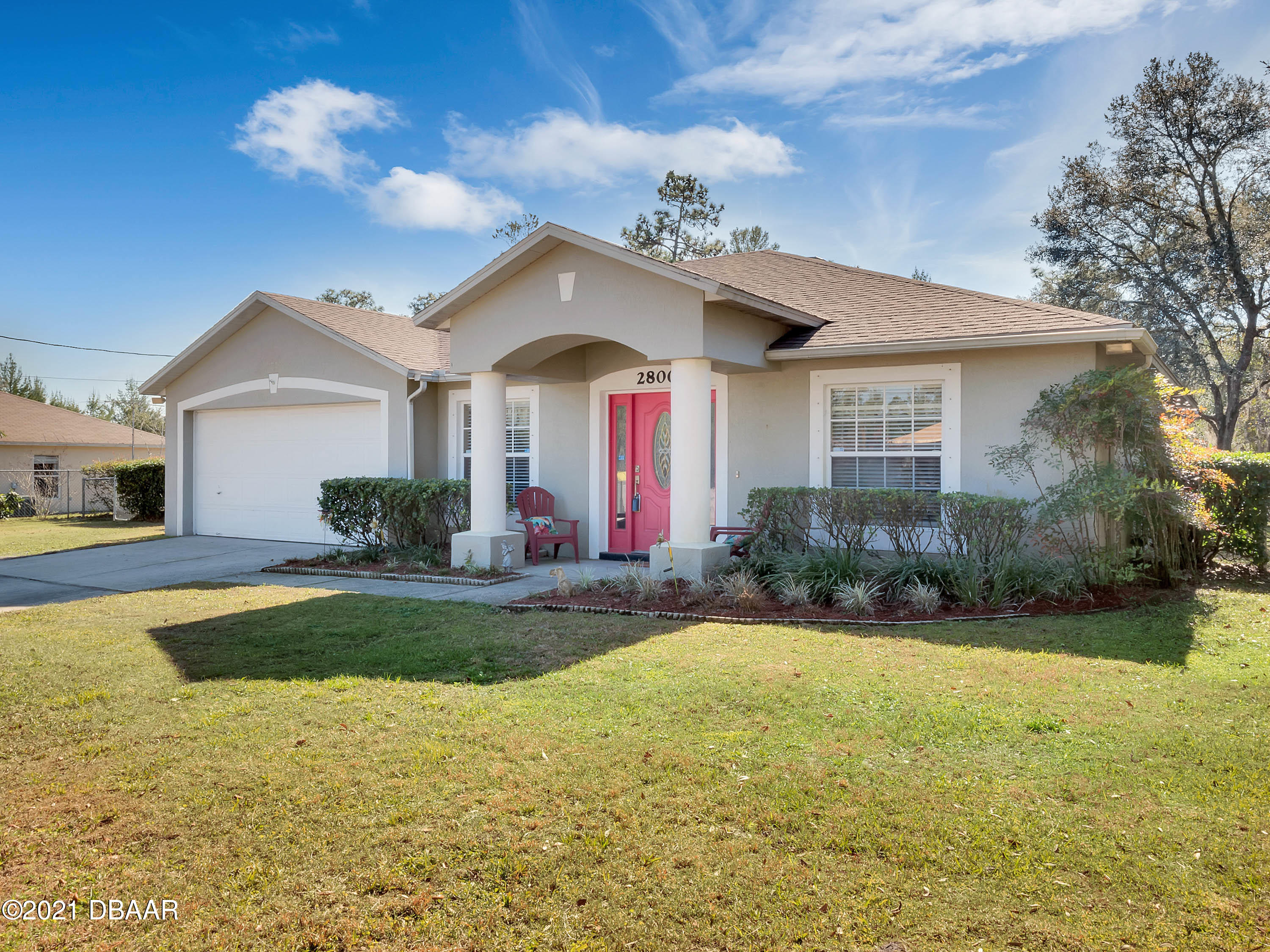 2800 Larkspur Road DeLand, FL 32724 - Photo 2 of 33 a view of a house with swimming pool and yard with green space