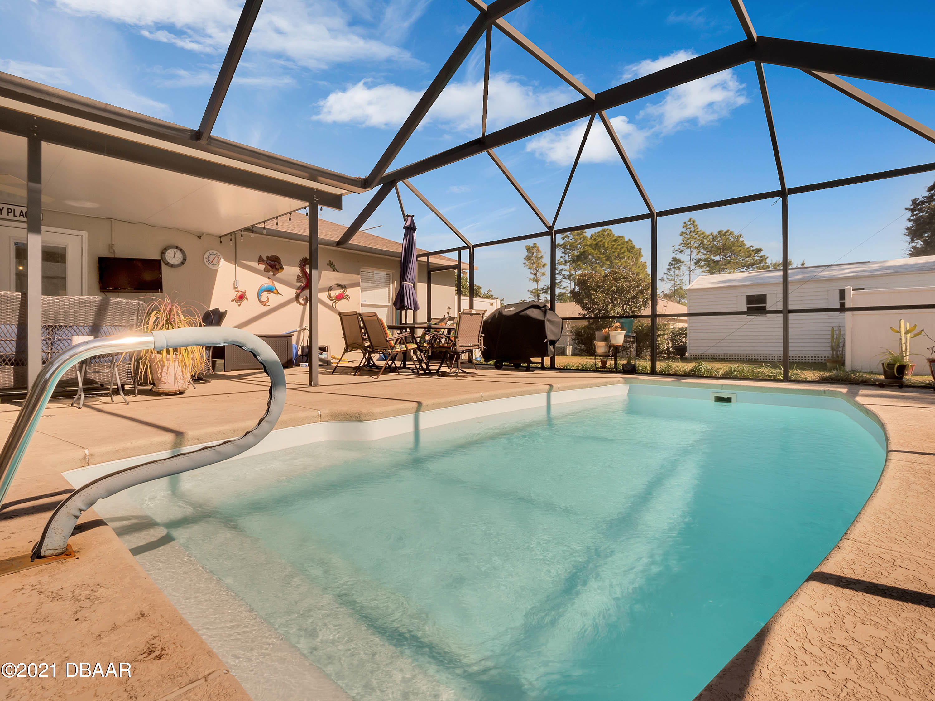 2800 Larkspur Road DeLand, FL 32724 - Photo 27 of 33 a view of a swimming pool with a bench