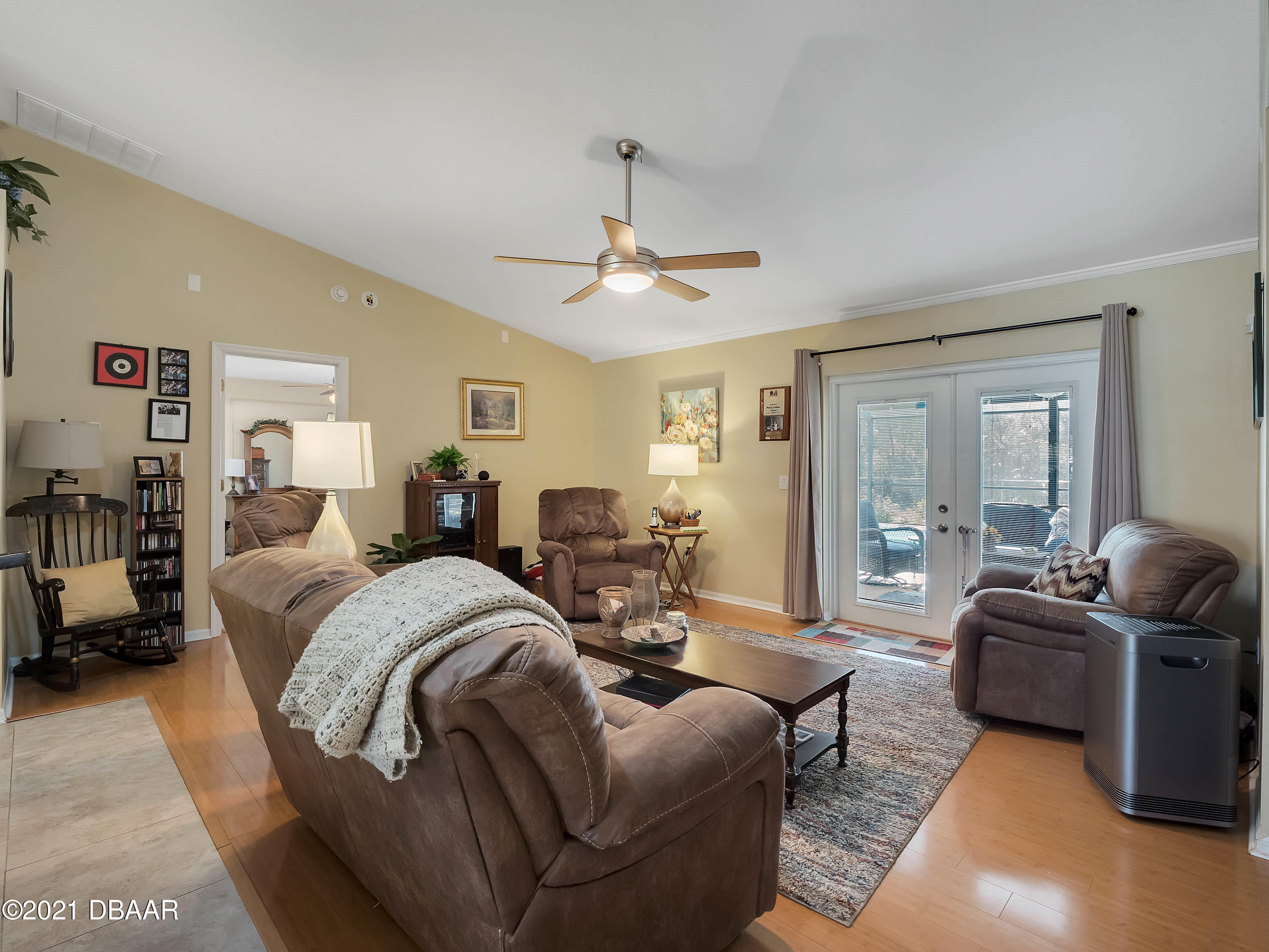 2800 Larkspur Road DeLand, FL 32724 - Photo 10 of 33 a living room with furniture ceiling fan and a window