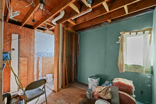 a living room with furniture and next to a window