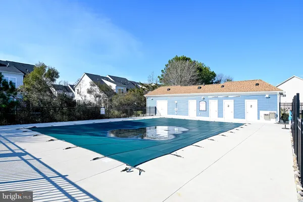 a view of a swimming pool with a yard