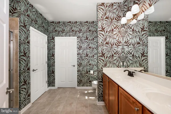 a bathroom with a sink and mirror