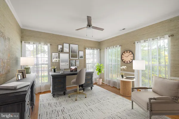 a workspace with furniture a chandelier and wooden floor