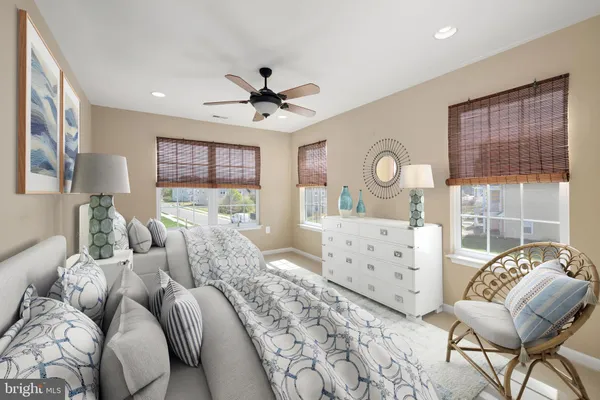 a bedroom with furniture and windows