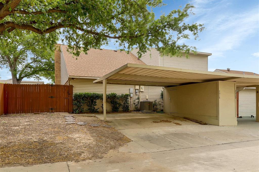 2018 Embassy Way Carrollton, TX 75006 - Photo 19 of 26 a view of a house with a tree
