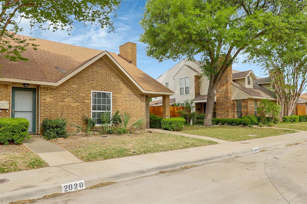 2018 Embassy Way Carrollton, TX 75006 - Photo 21 of 26 front view of a house with a yard