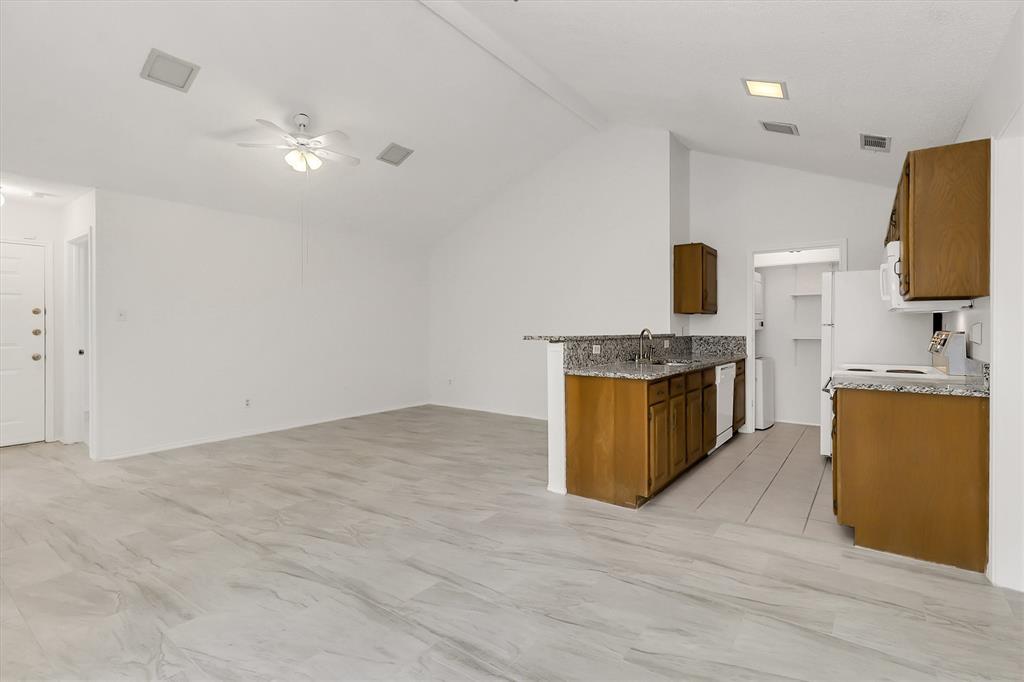 2018 Embassy Way Carrollton, TX 75006 - Photo 6 of 26 a kitchen with a sink appliances and cabinets