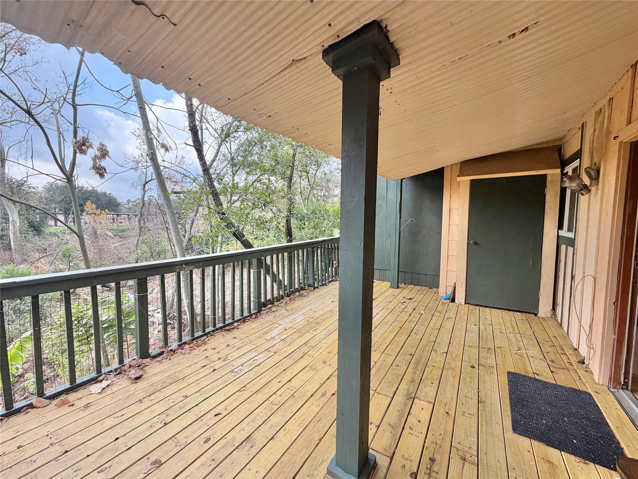 8225 Kingsbrook Road, Unit 116 Houston, TX 77024 - Photo 19 of 21 a view of balcony and wooden floor