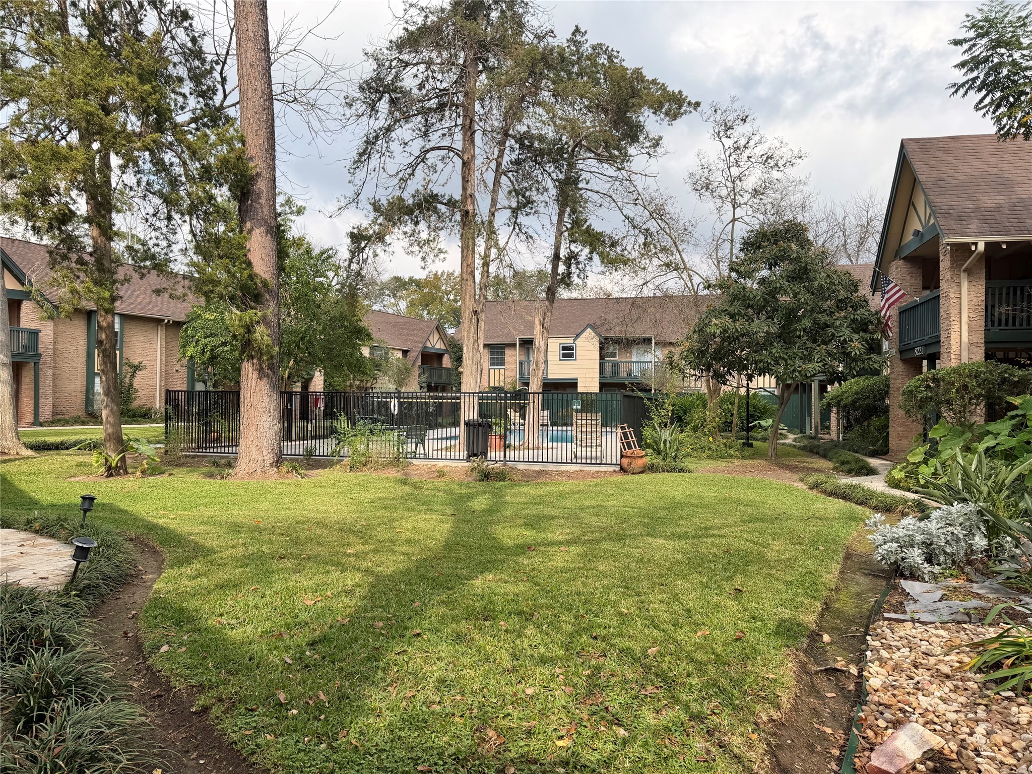 8225 Kingsbrook Road, Unit 116 Houston, TX 77024 - Photo 21 of 21 a swimming pool with outdoor seating and yard