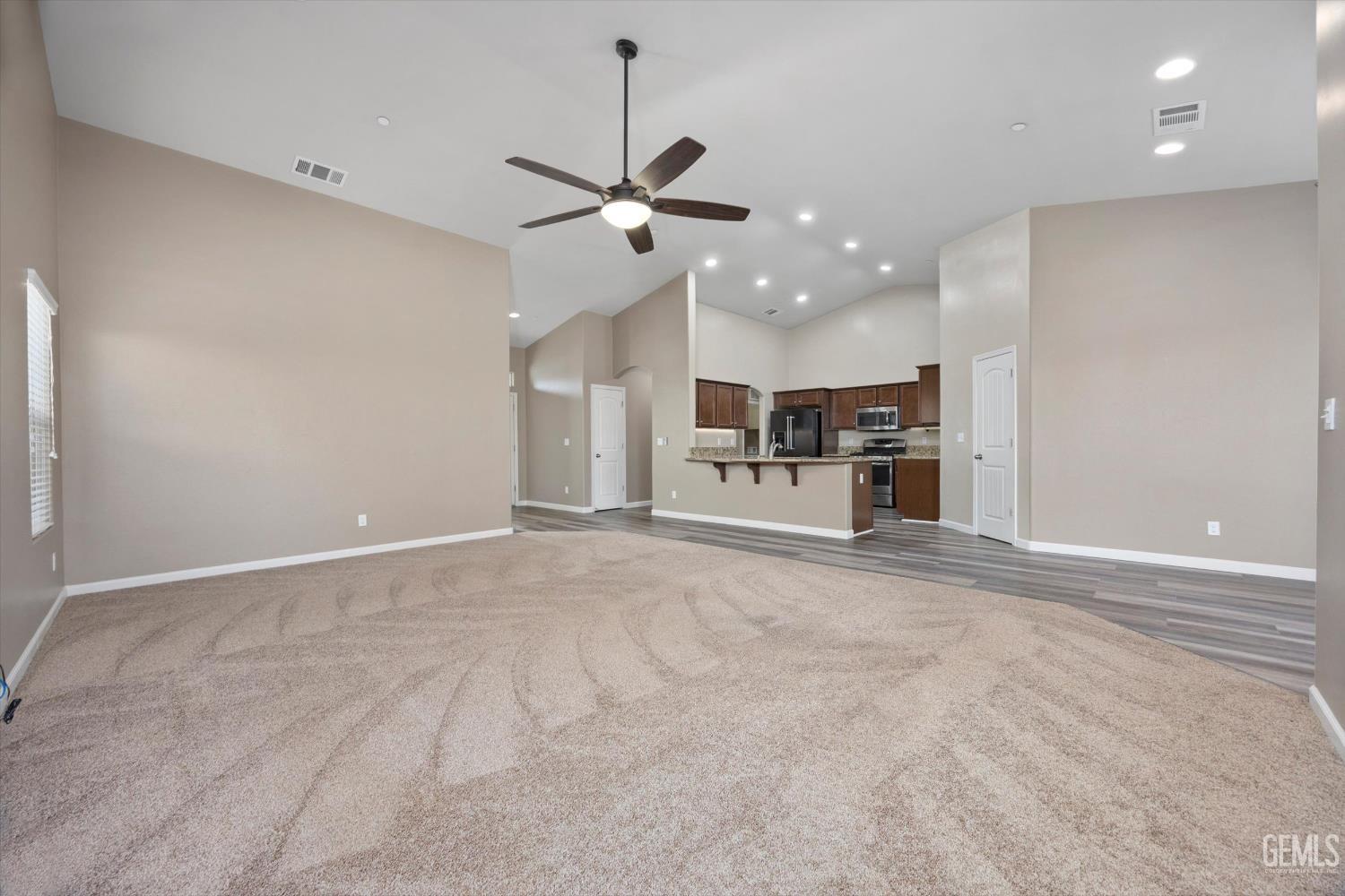 Undisclosed Address Bakersfield, CA 93314 - Photo 13 of 42 a view of a kitchen with a sink and a refrigerator