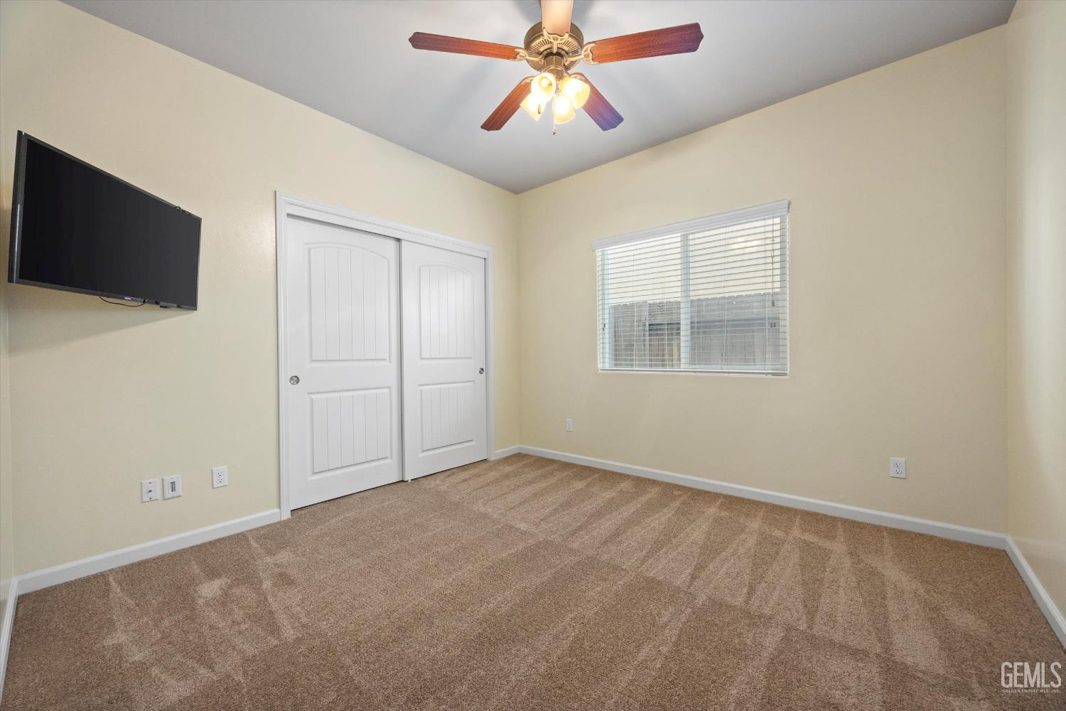 Undisclosed Address Bakersfield, CA 93314 - Photo 29 of 42 an empty room with windows and fan