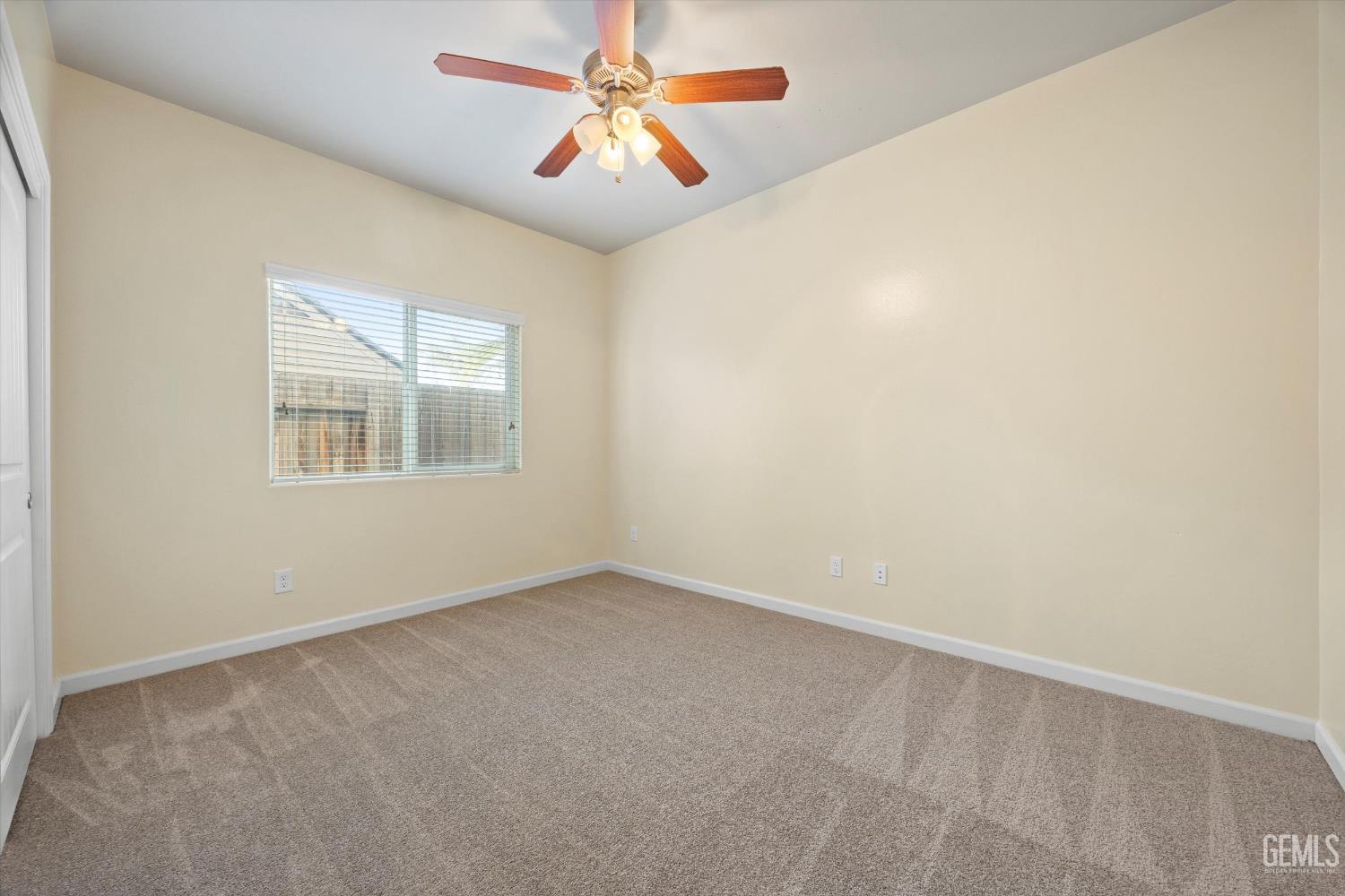 Undisclosed Address Bakersfield, CA 93314 - Photo 31 of 42 an empty room with windows and fan