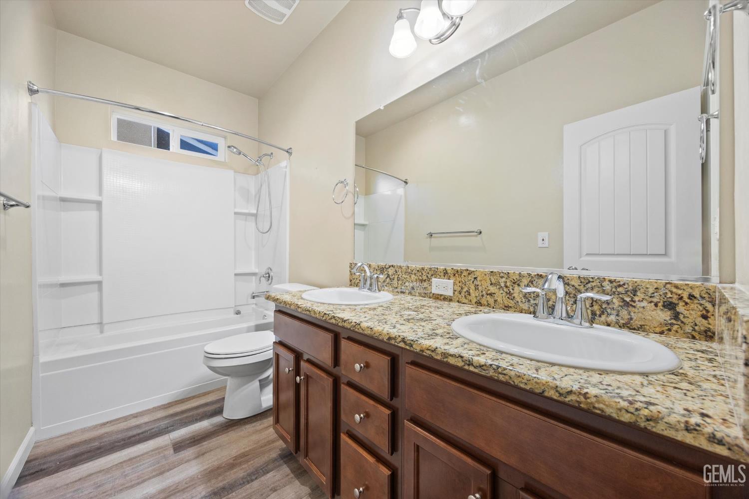 Undisclosed Address Bakersfield, CA 93314 - Photo 33 of 42 a bathroom with a granite countertop sink toilet and shower