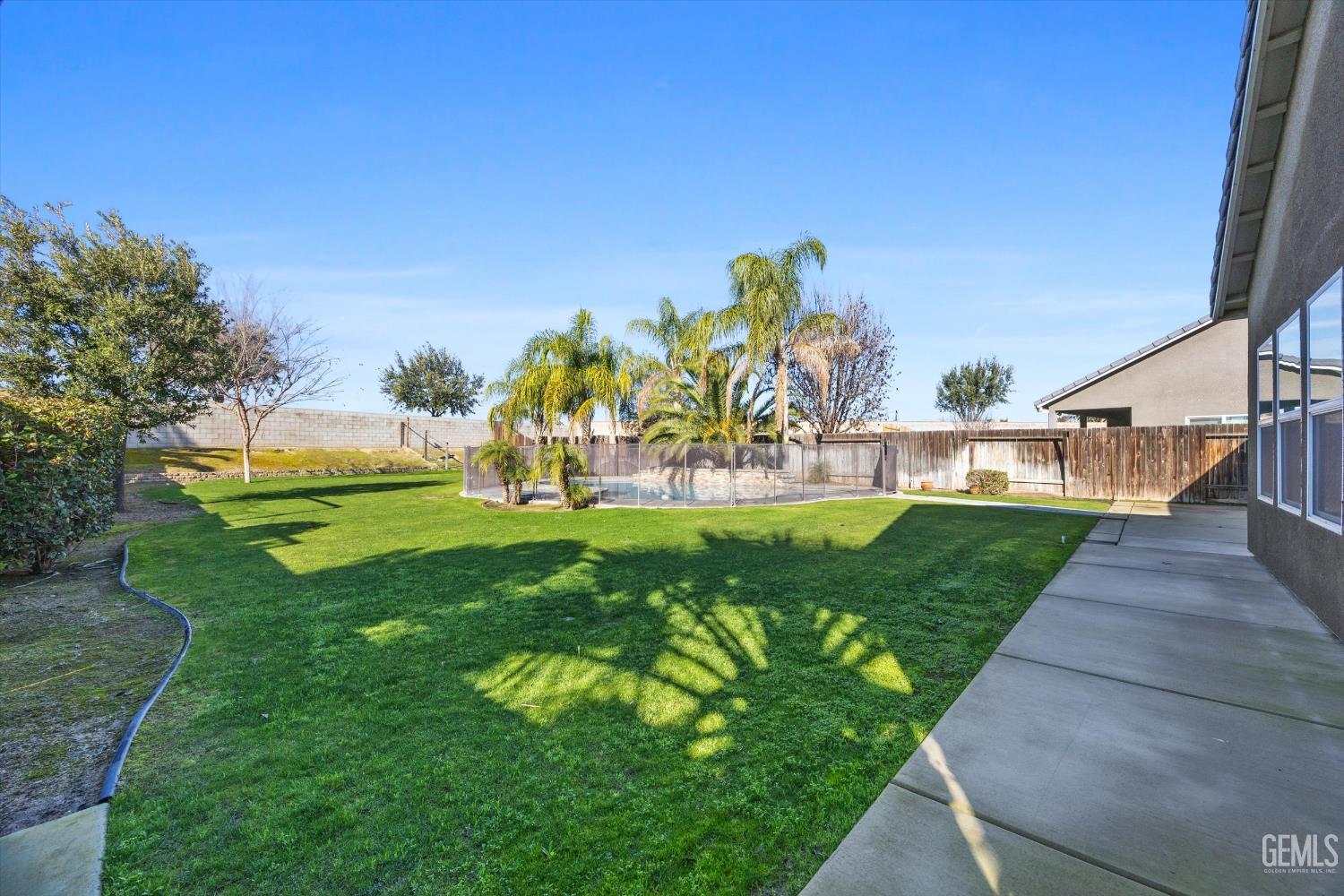 Undisclosed Address Bakersfield, CA 93314 - Photo 41 of 42 a view of a park with plants and trees