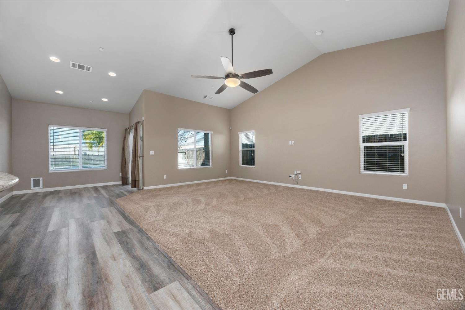 Undisclosed Address Bakersfield, CA 93314 - Photo 9 of 42 a view of an empty room with window and chandelier fan