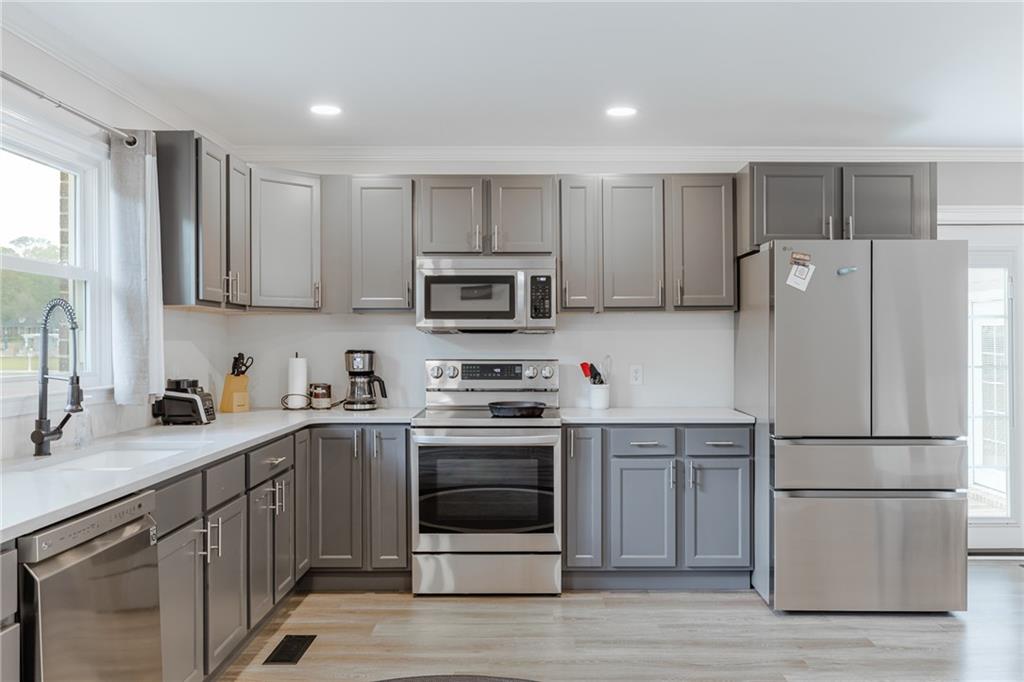 434 Rawley Road Americus, GA 31719 - Photo 22 of 50 a kitchen with a sink cabinets and stainless steel appliances