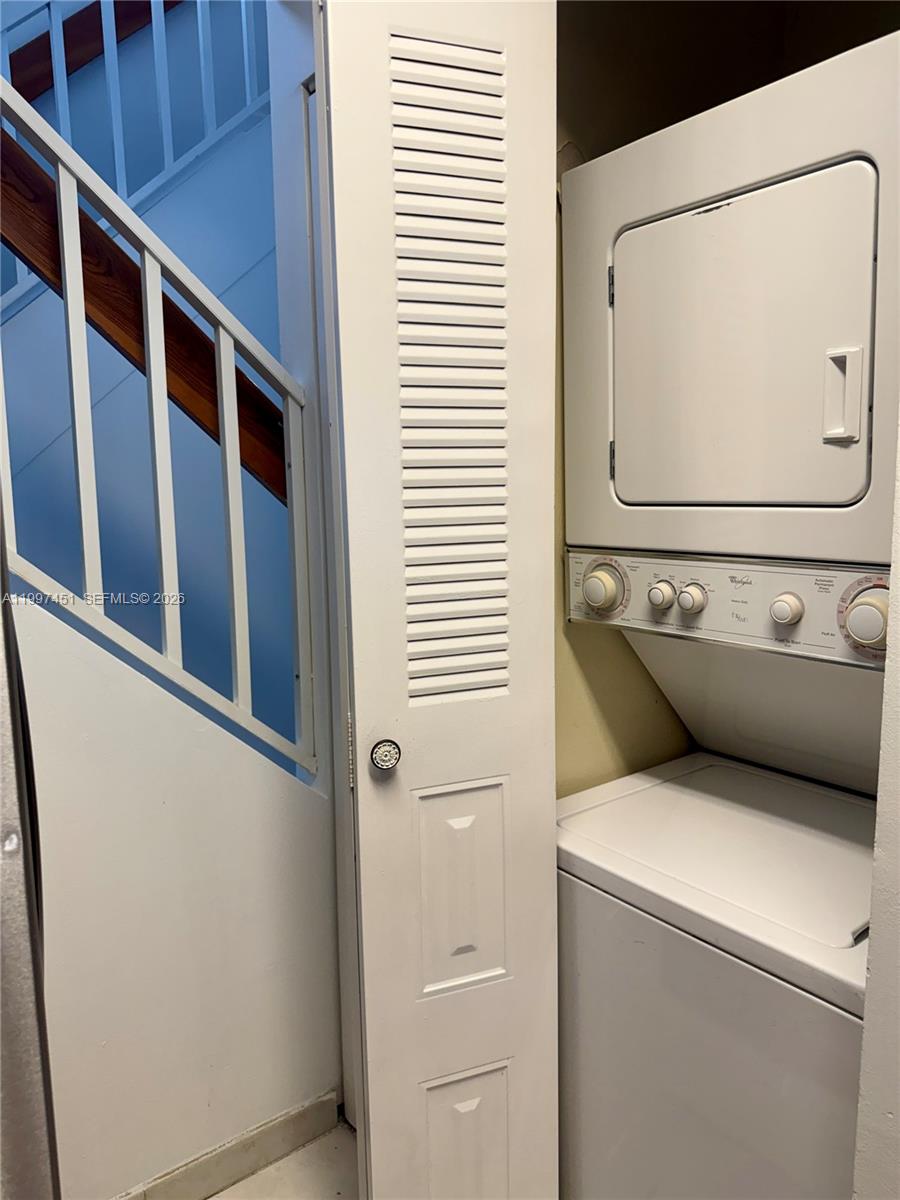 9435 Southwest 140th Court, Unit 9435 Miami, FL 33186 - Photo 19 of 33 a utility room with dryer and washer