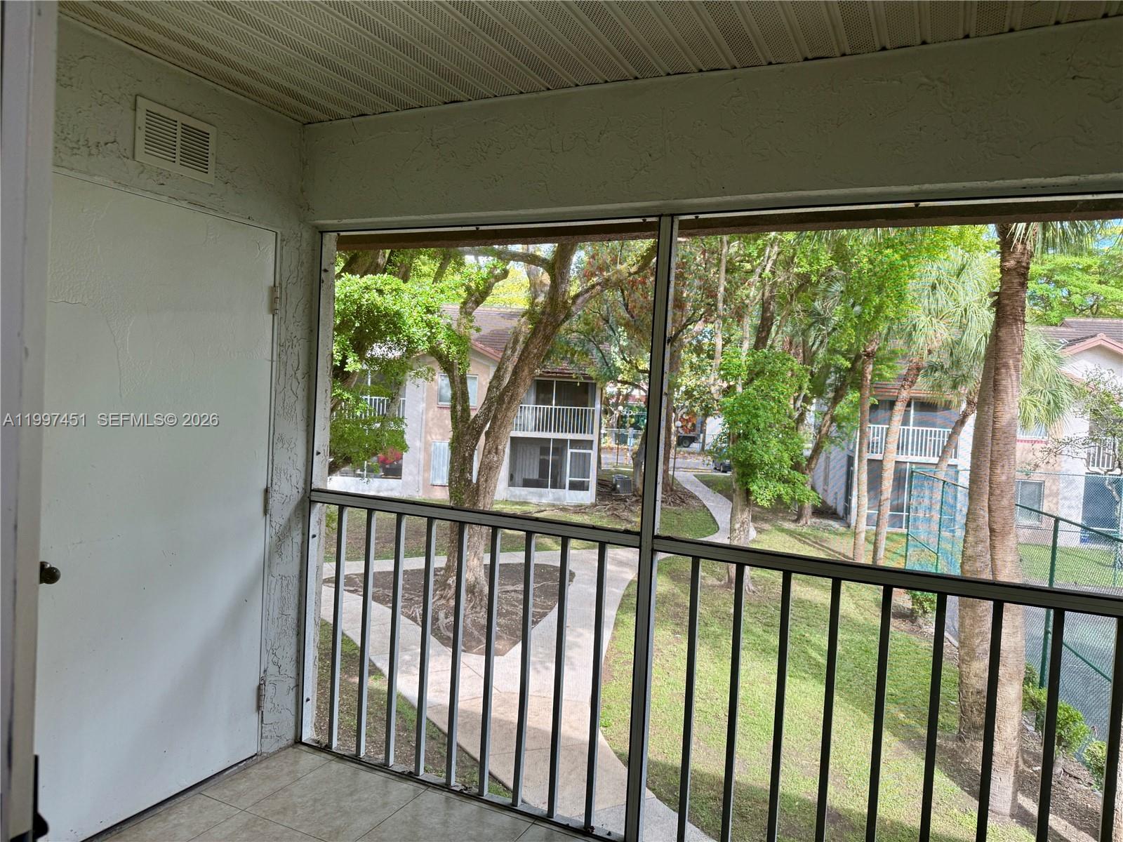 9435 Southwest 140th Court, Unit 9435 Miami, FL 33186 - Photo 22 of 33 a view of a balcony with an outdoor space