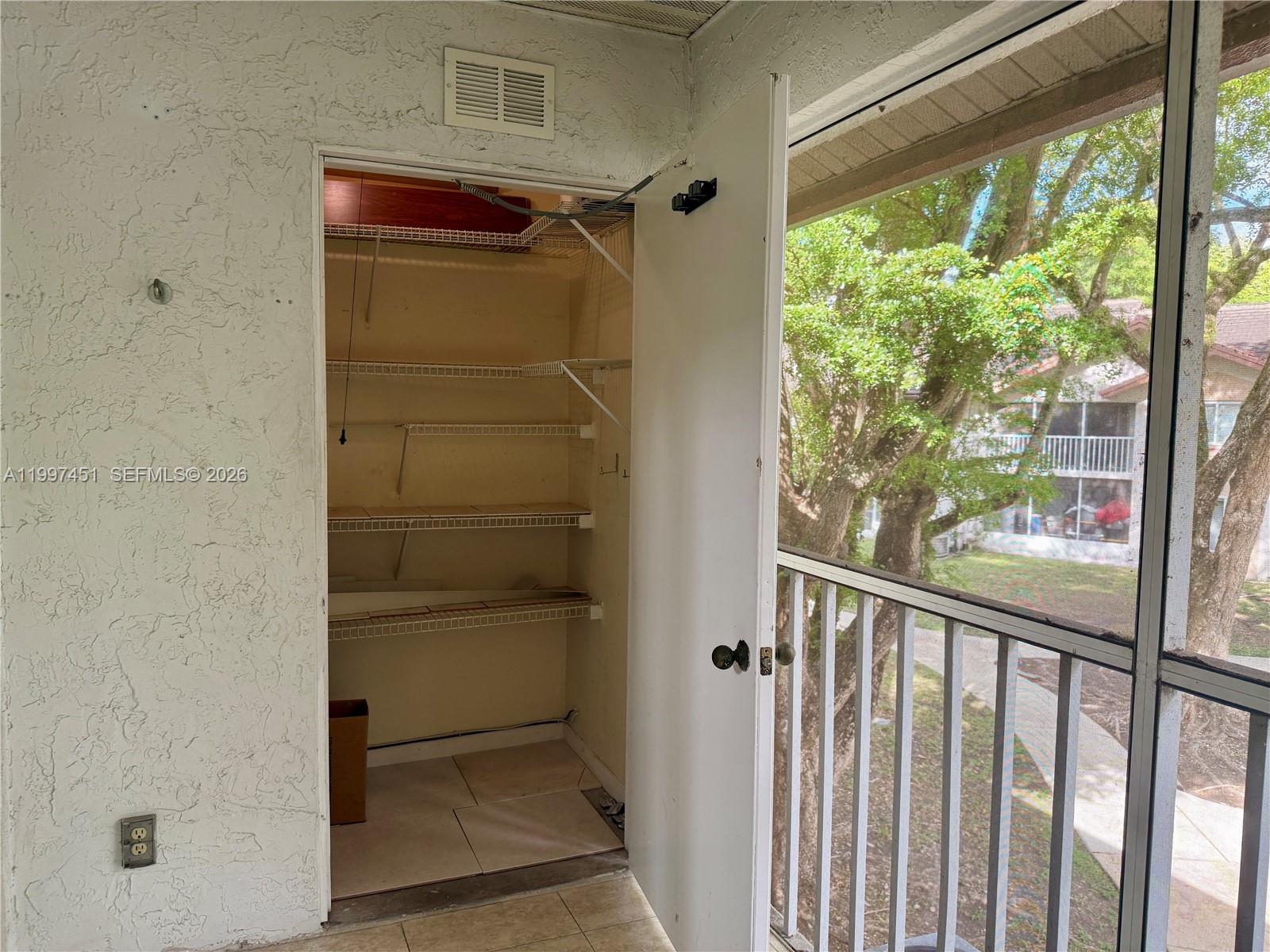9435 Southwest 140th Court, Unit 9435 Miami, FL 33186 - Photo 23 of 33 a view of a walk in closet