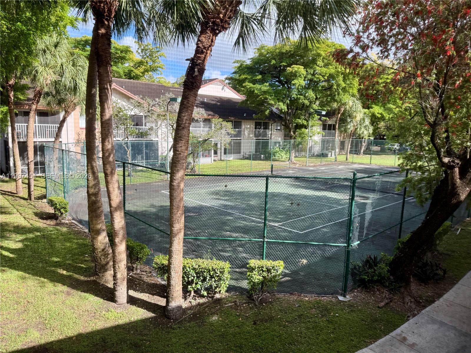 9435 Southwest 140th Court, Unit 9435 Miami, FL 33186 - Photo 25 of 33 a view of a garden from a tree