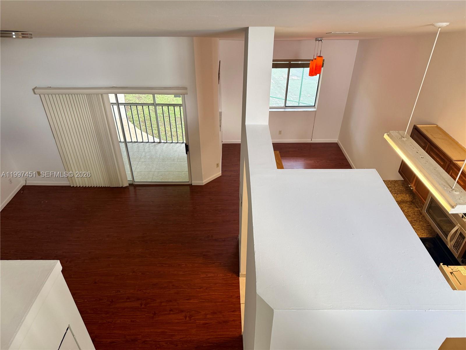 9435 Southwest 140th Court, Unit 9435 Miami, FL 33186 - Photo 26 of 33 a view of an empty room with windows